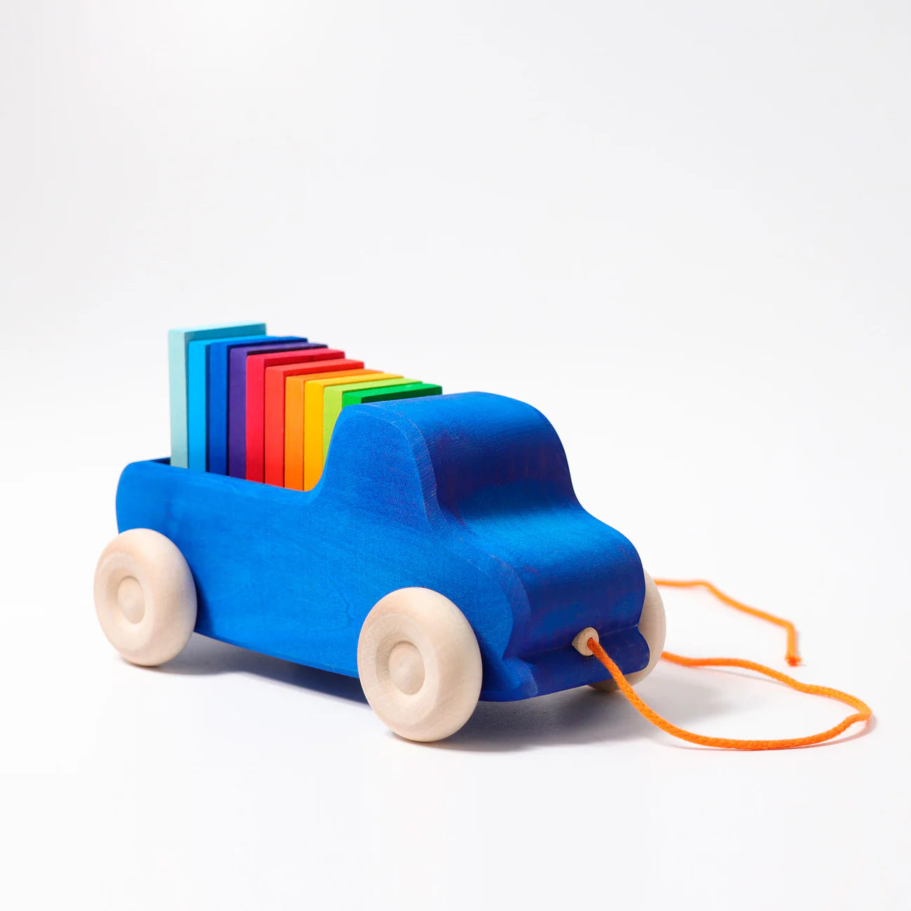 Colorful toy truck with rainbow slats on a white background