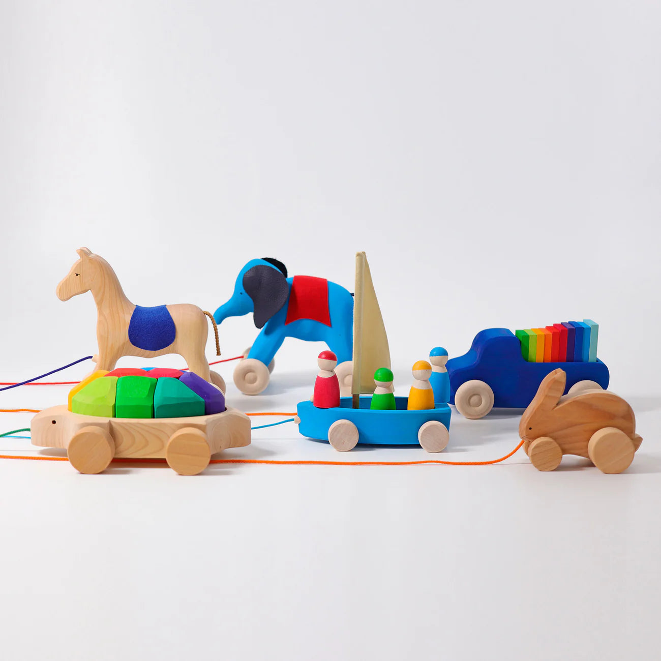 Set of colorful wooden toys on a white background