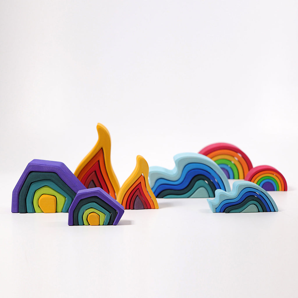 Colorful rainbow-shaped objects on a white background