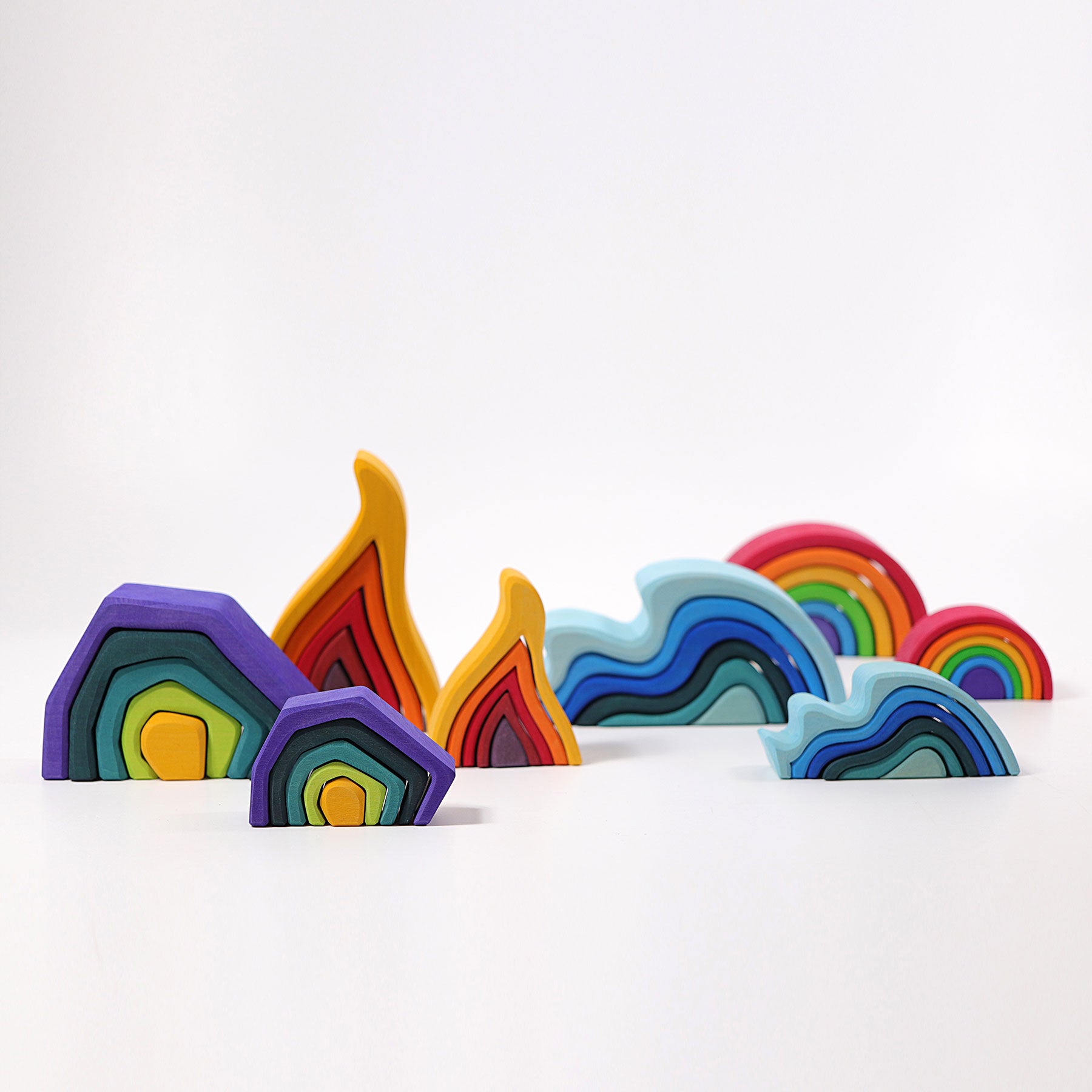 Colorful rainbow-shaped objects on a white background