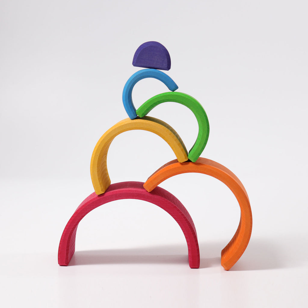 Colorful wooden arches toy on a white background