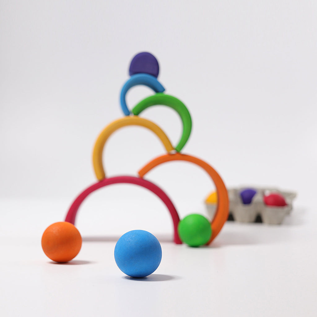 Colorful toy rings and balls on a white background