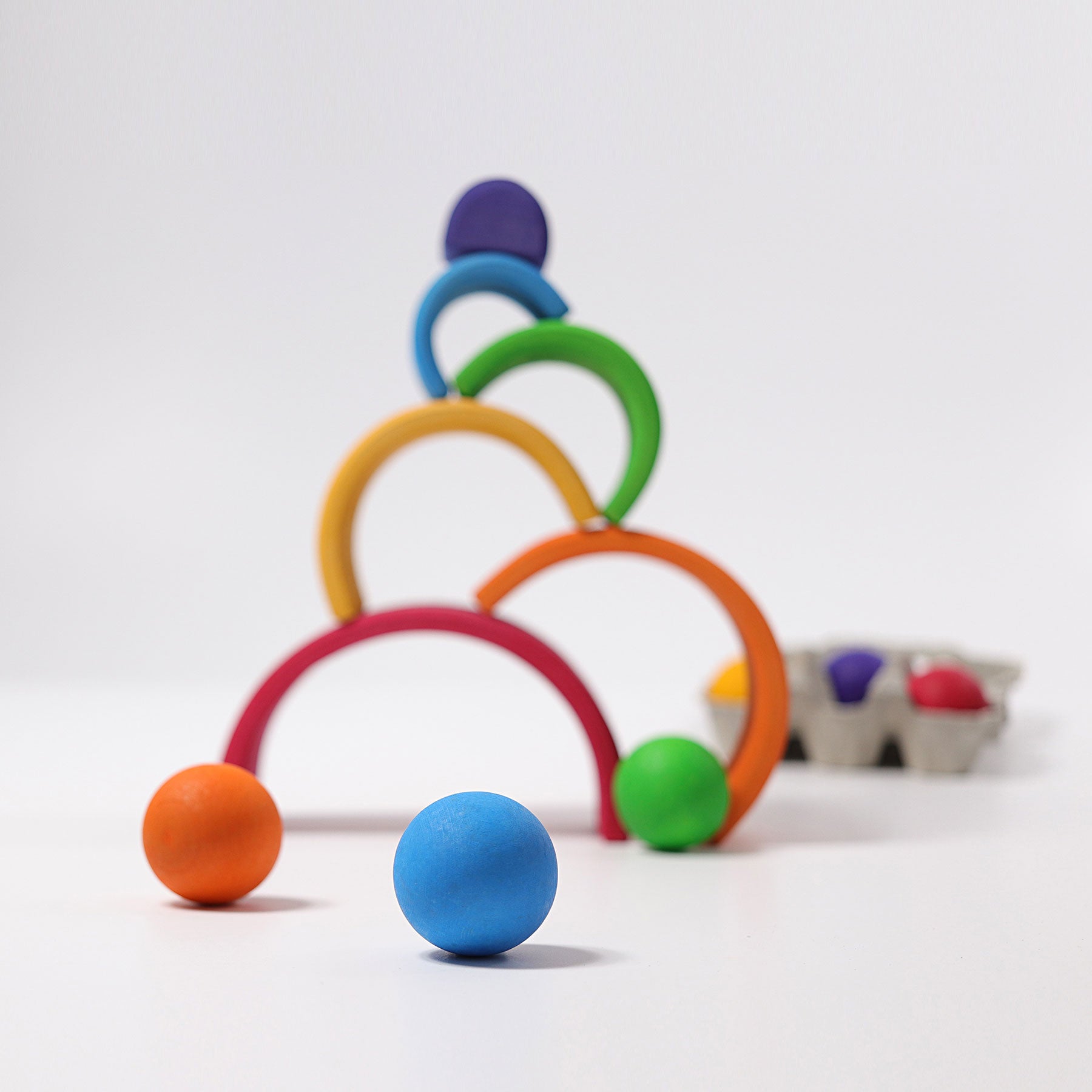 Colorful toy rings and balls on a white background