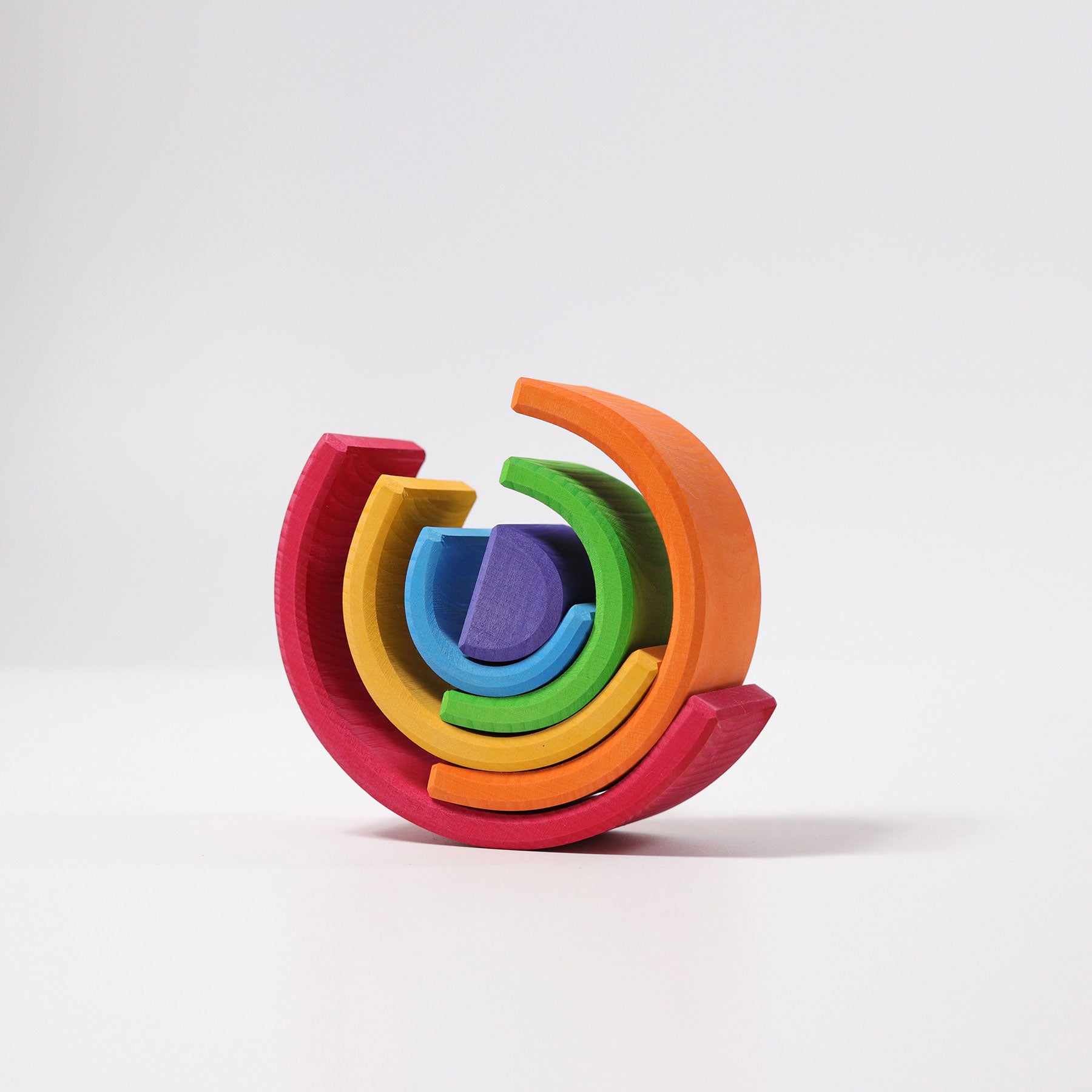 Colorful wooden toy with interlocking pieces on a white background