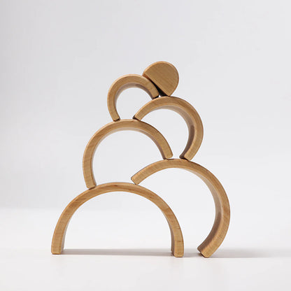 Wooden arch-shaped decorative item on a white background