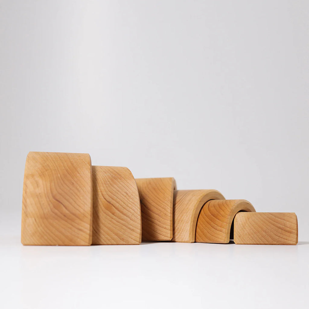 Set of wooden blocks of different sizes on a white background