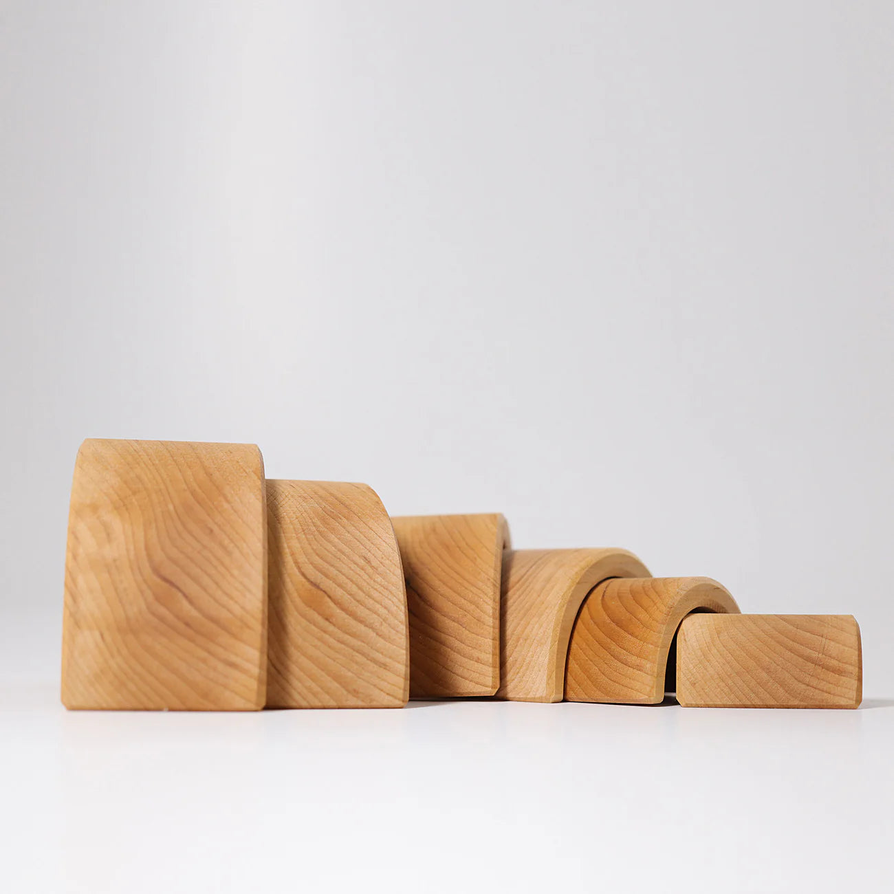 Set of wooden blocks of different sizes on a white background