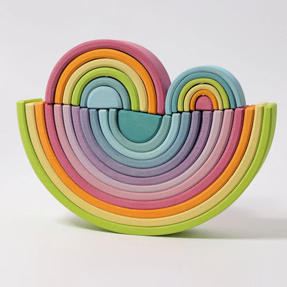 Colorful wooden toy set shaped like a rainbow on a white background