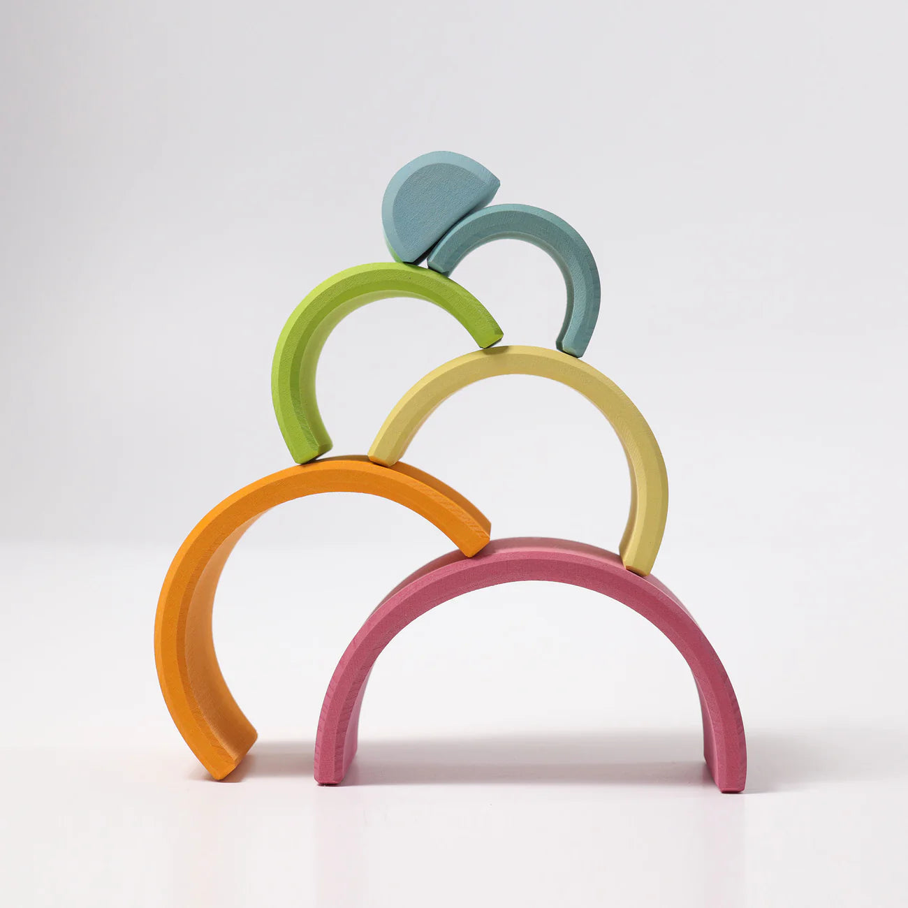 Colorful arch-shaped toy on a white background