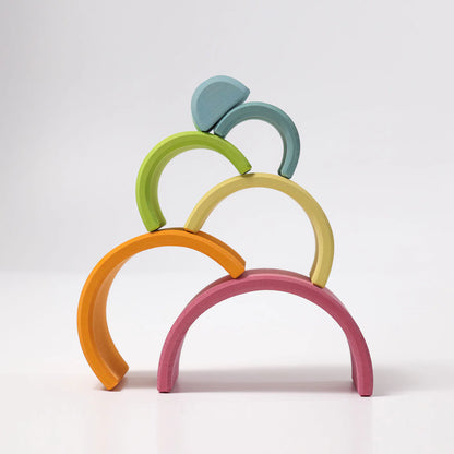 Colorful arch-shaped toy on a white background