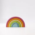 Colorful wooden rainbow toy on a white background