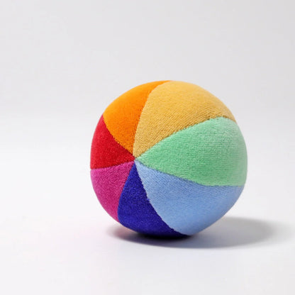 Multicolored ball with rainbow pattern on a white background