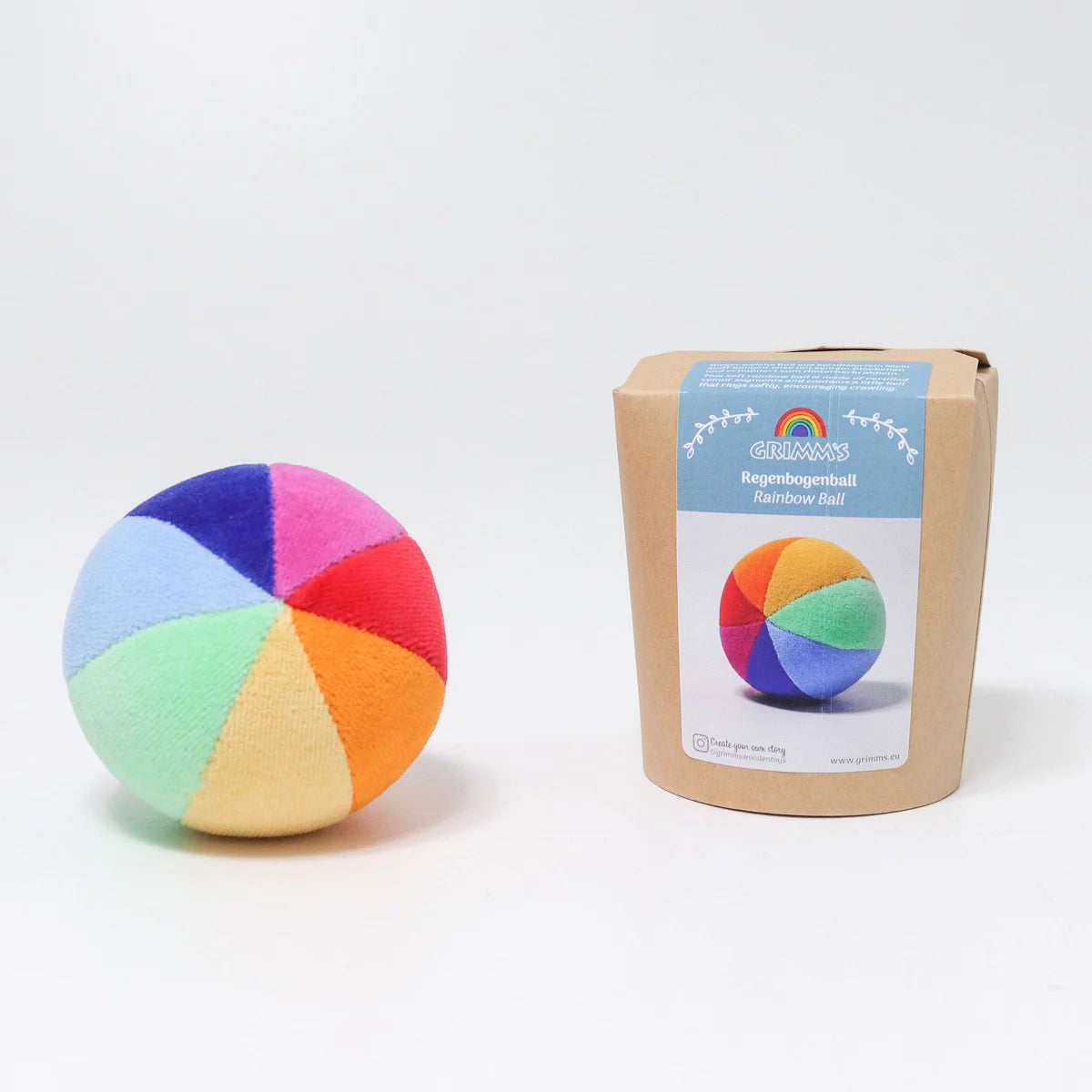 Colorful ball with a cardboard box labeled 'Rainbow Ball' on a white background