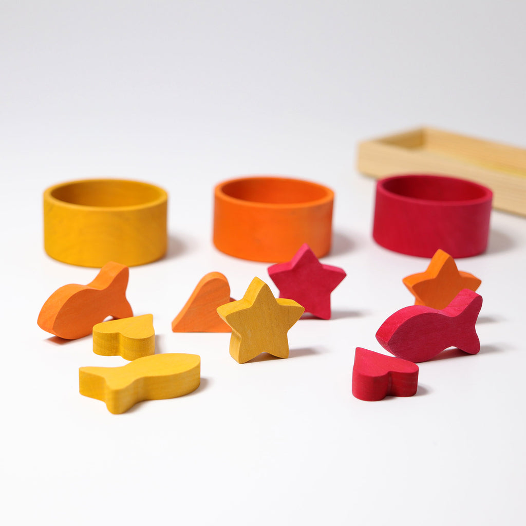 Colorful wooden shape blocks on a white background
