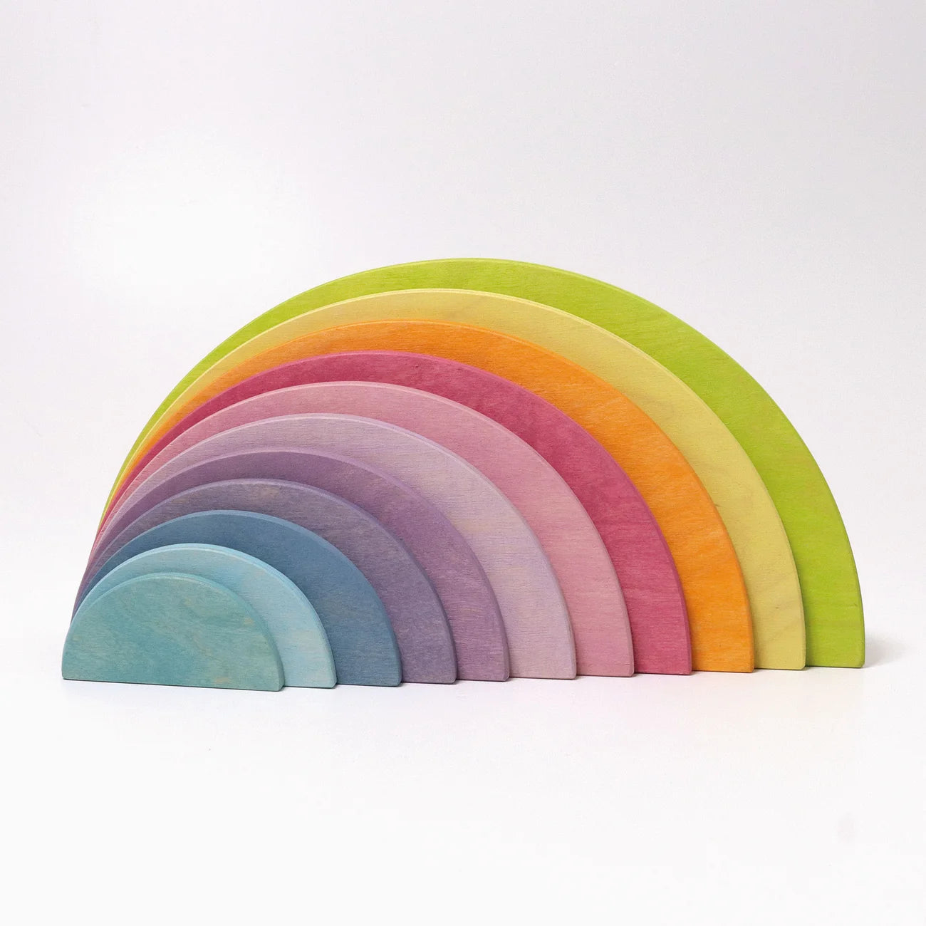 Set of colorful wooden rainbow toys on a white background