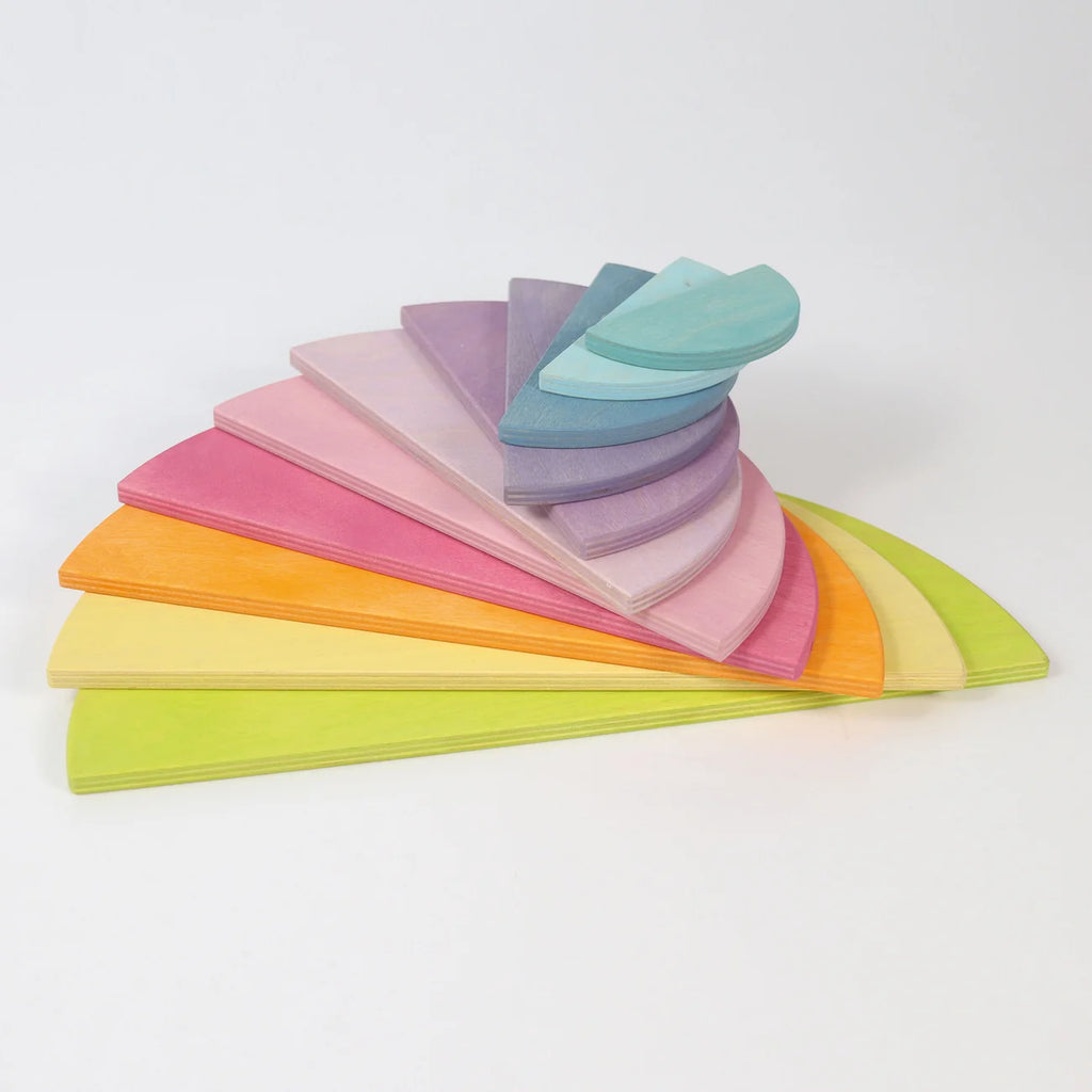 Stack of colorful paper sheets arranged in a fan shape on a white background