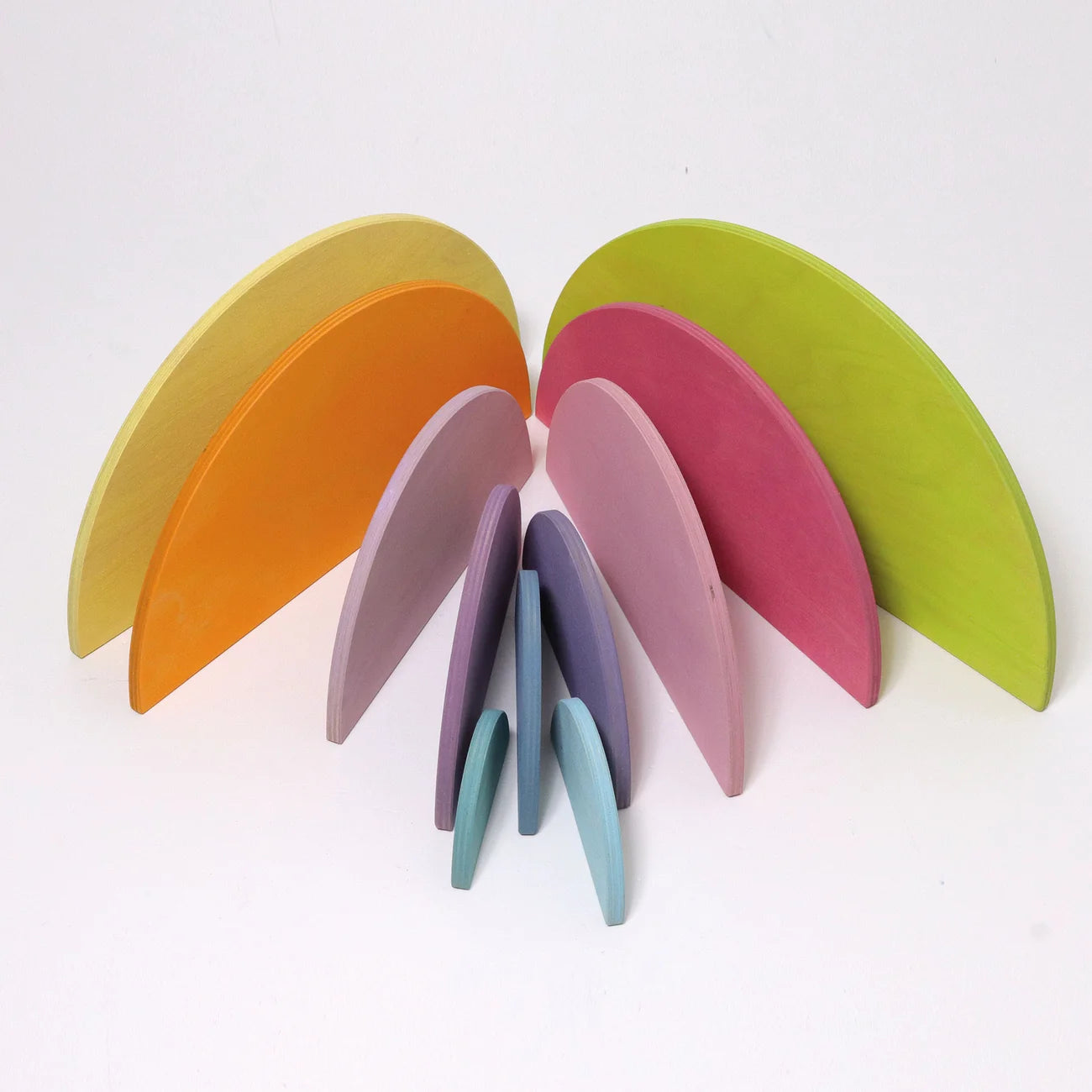 Set of colorful coasters arranged in a semi-circle on a white background