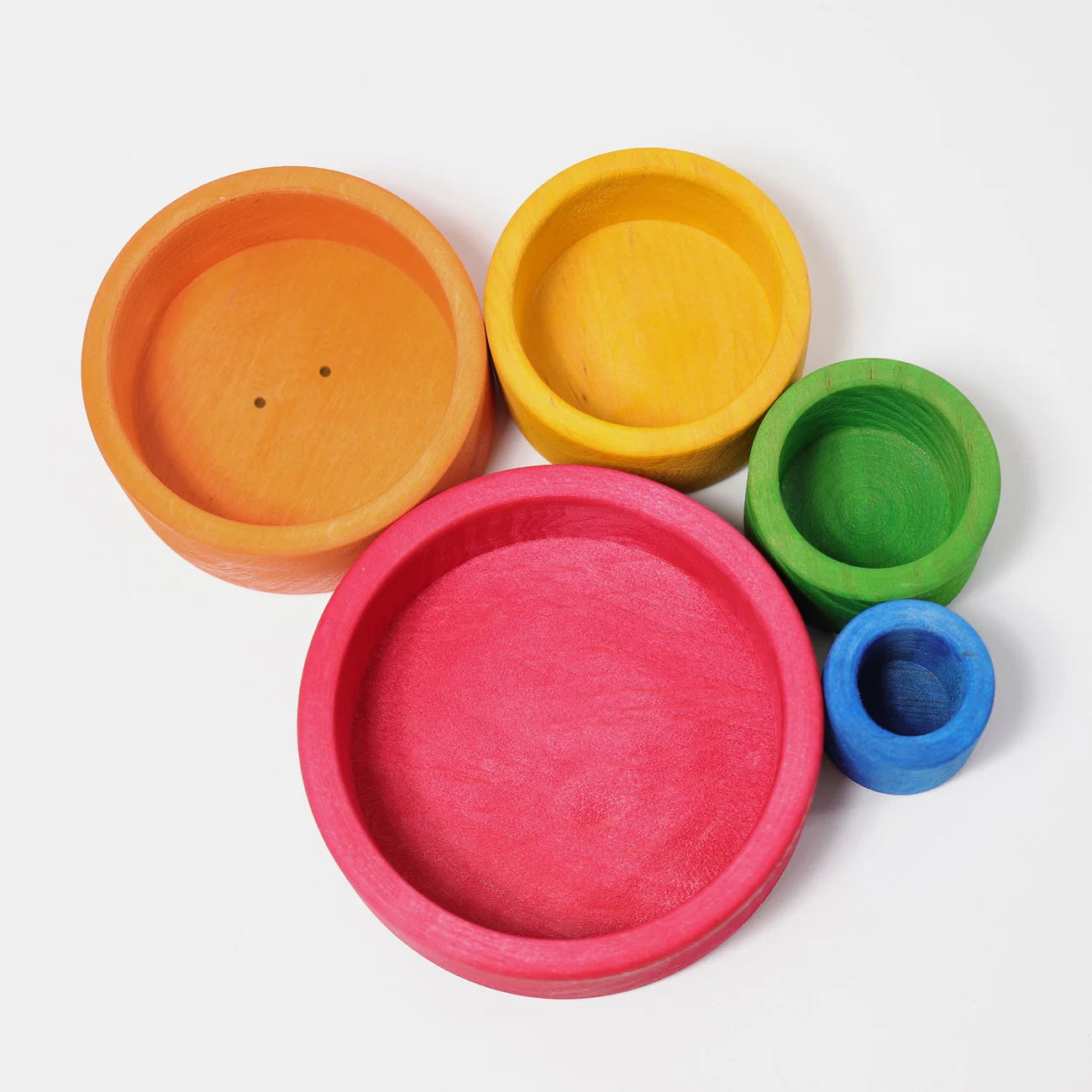 Set of colorful wooden bowls on a white background