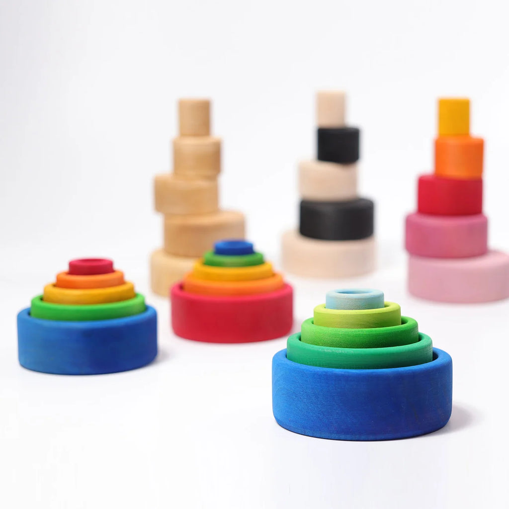 Colorful wooden stacking rings on a white background