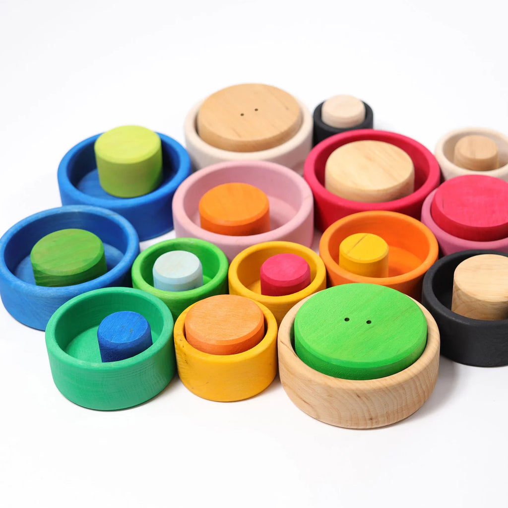 Colorful wooden toys with circular shapes on a white background