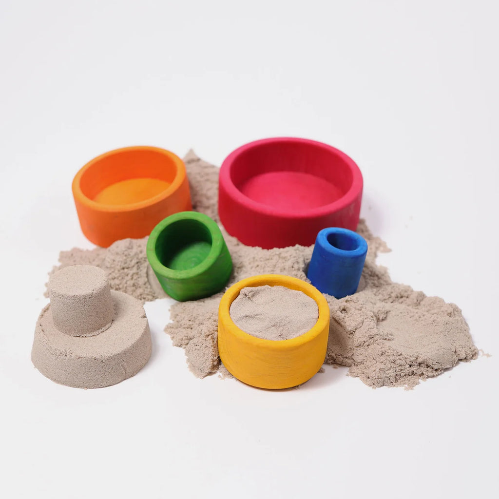 Colorful sand toys with a white background