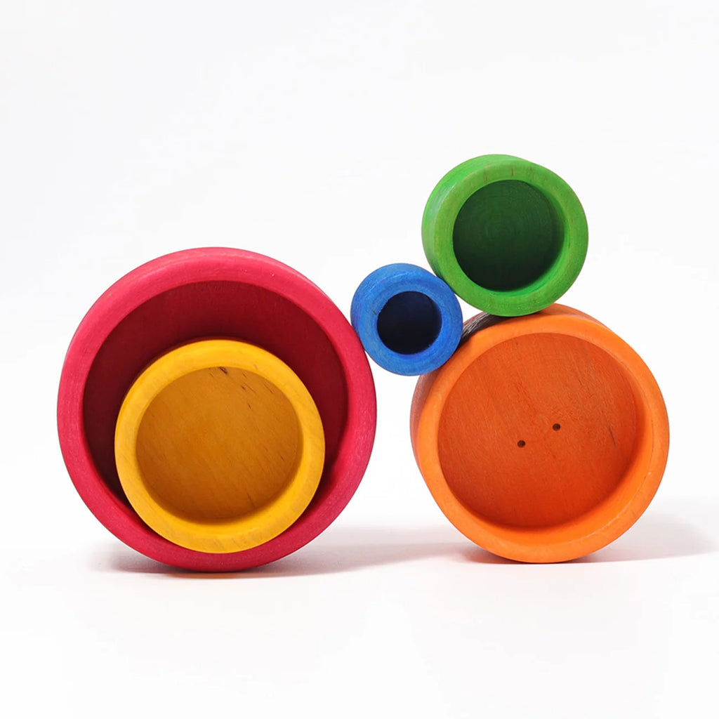 Set of colorful wooden bowls on a white background