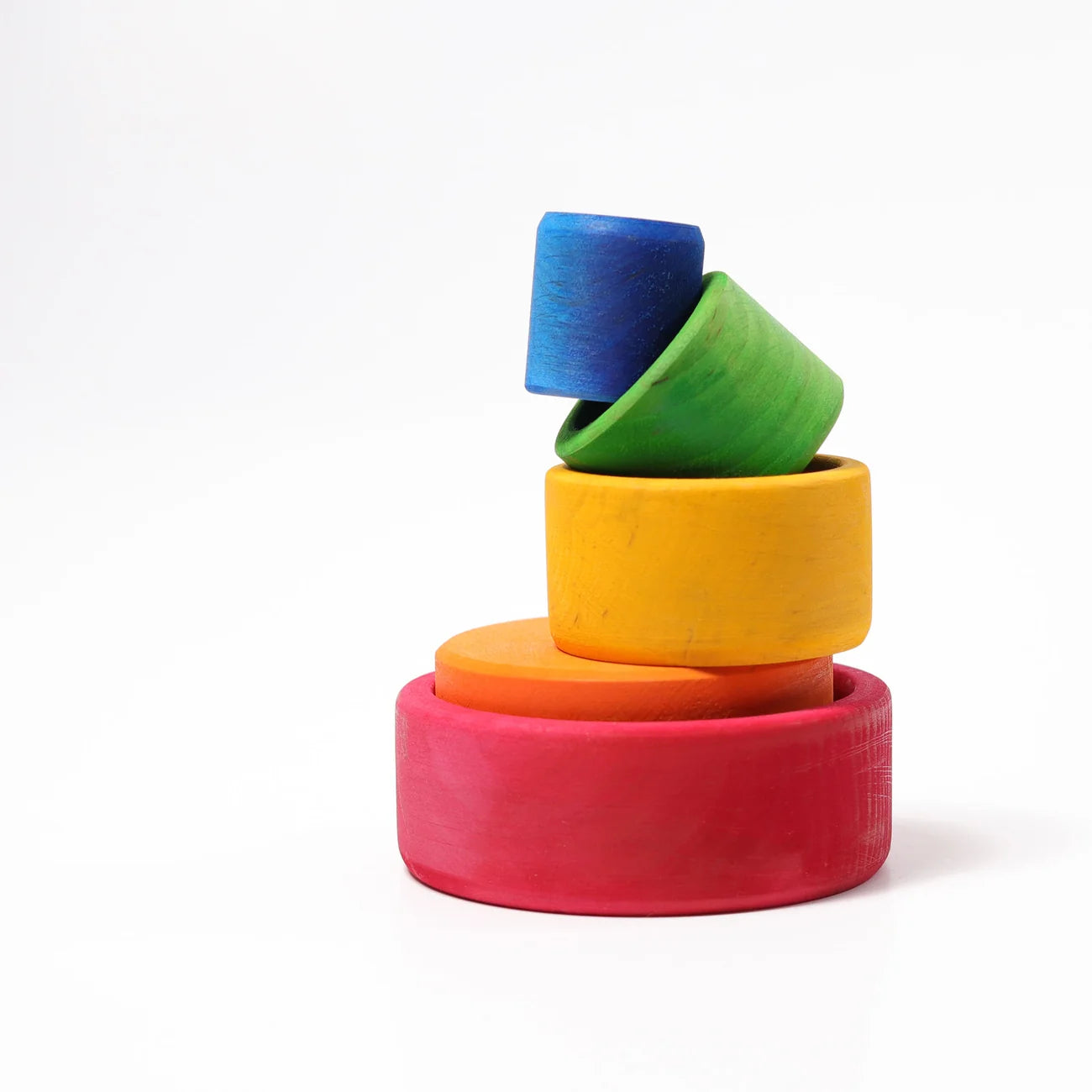 Stack of colorful wooden rings on a white background
