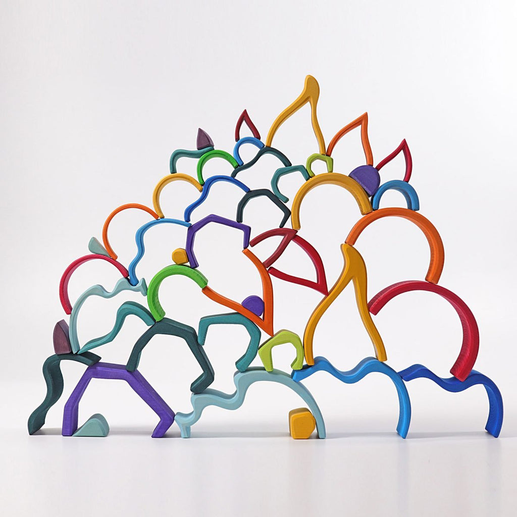 Colorful abstract sculpture of interlocking forms on a white background