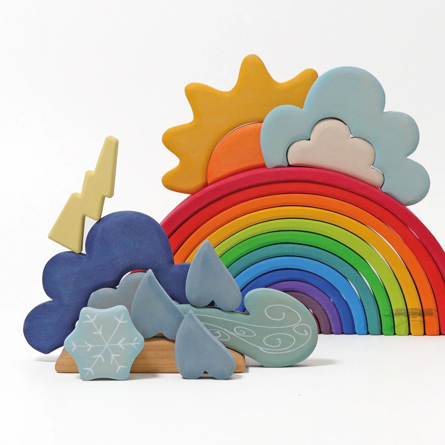 Colorful wooden weather set with rainbow, sun, clouds, and other elements on a white background