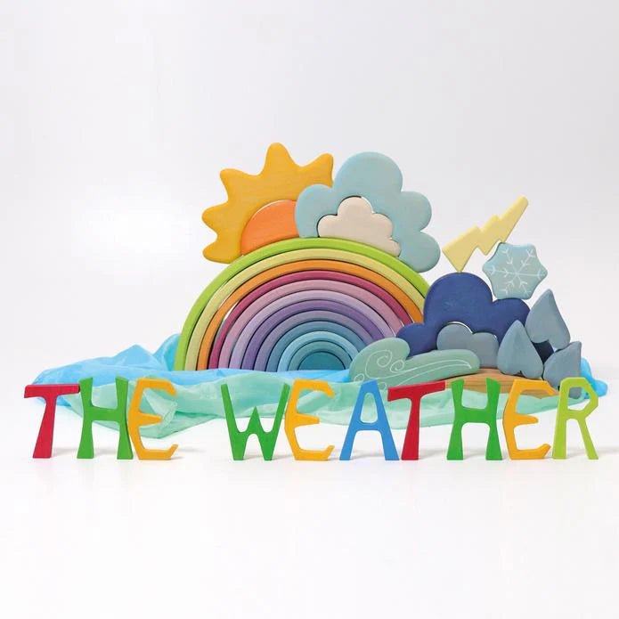 Colorful weather-themed wooden toy set with rainbow, sun, clouds, and letters spelling 'THE WEATHER' on a white background.