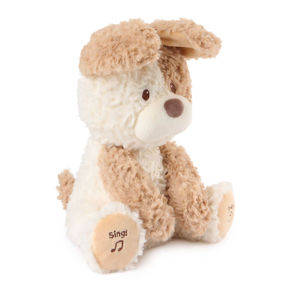 Plush dog toy with brown and white fur on a white background