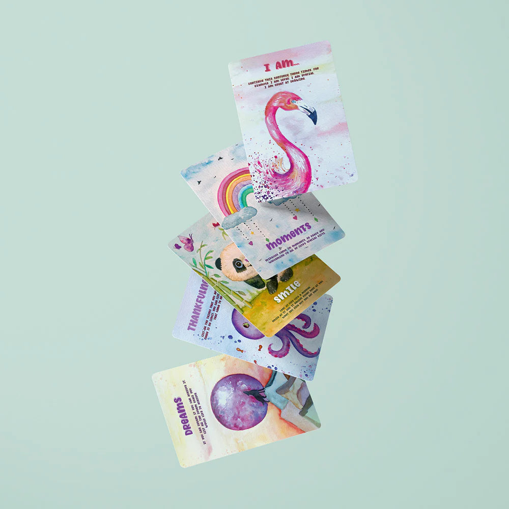 Stack of colorful flash cards with various designs on a light green background