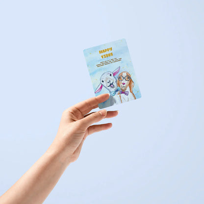 Hand holding a card with cartoon characters on a light blue background