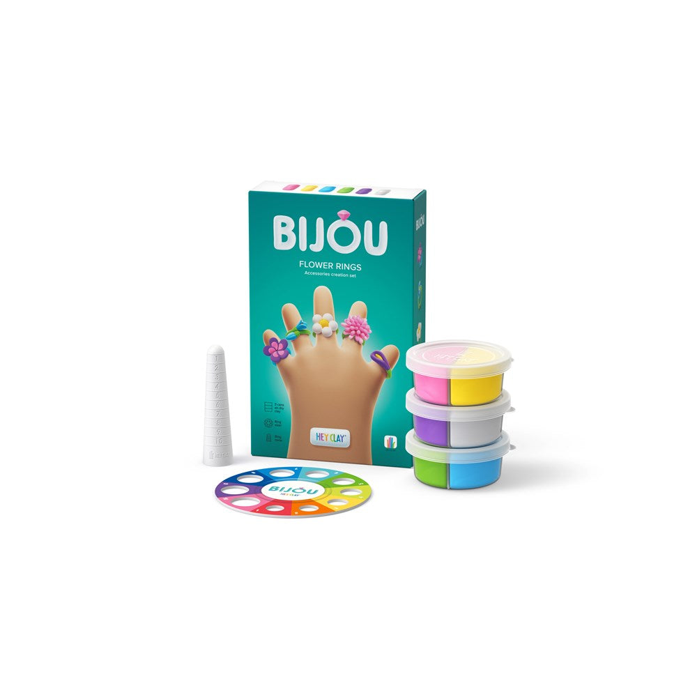 Bijou flower ring kit with packaging, rings, and a color wheel on a white background