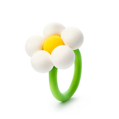 Flower-shaped teething ring with white beads and a yellow center on a white background