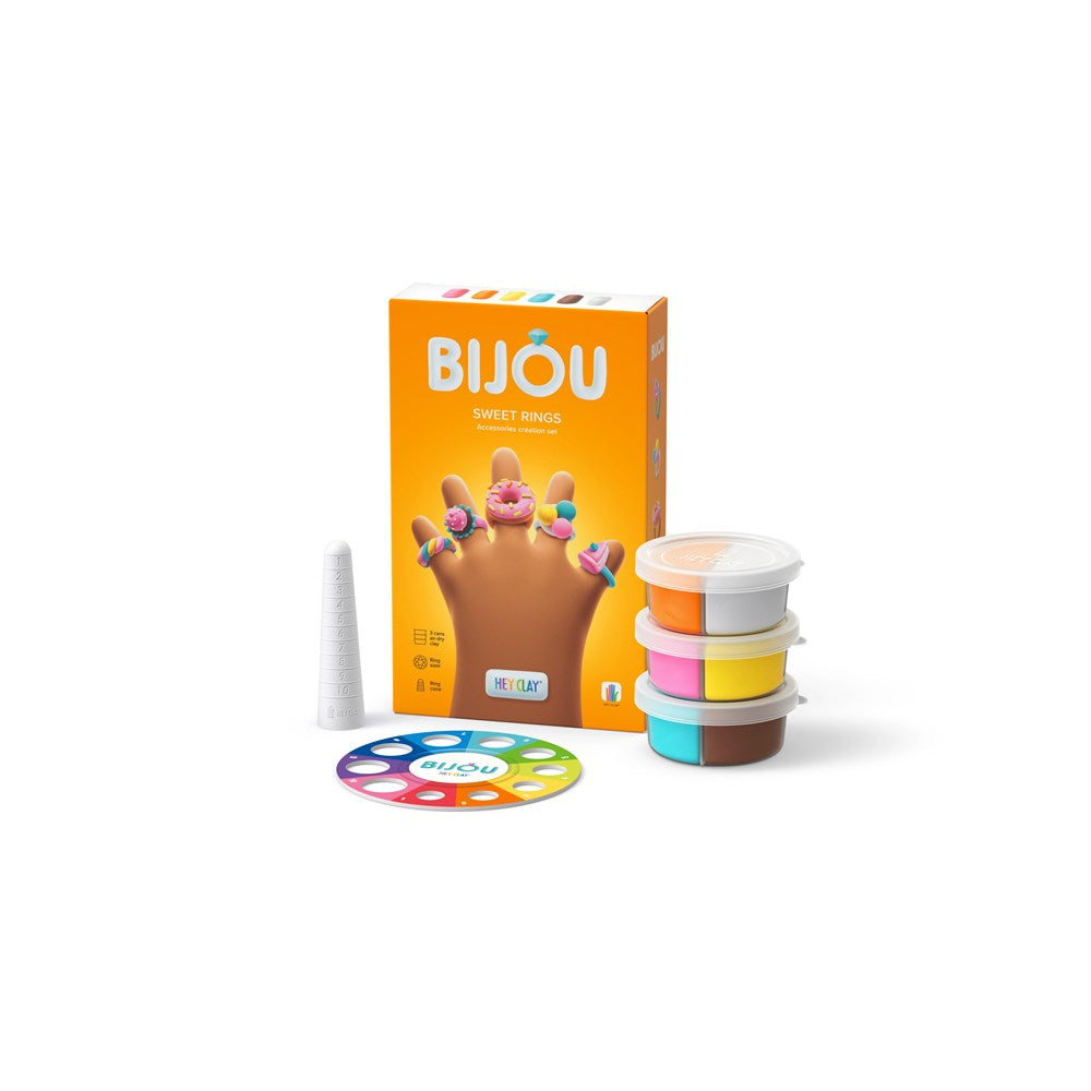 Bijou product set including packaging, colorful containers, and a palette on a white background