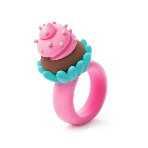 Pink ring with a cupcake design on a white background