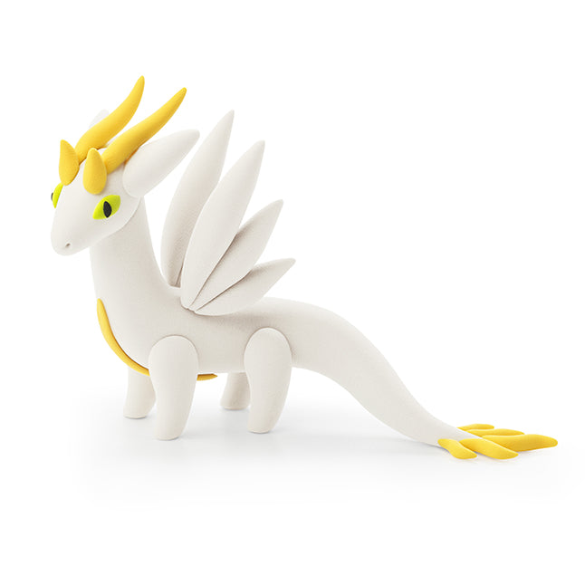 White dragon toy with yellow accents on a white background