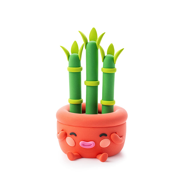 Cute cartoon-style pot with green bamboo sticks on a white background