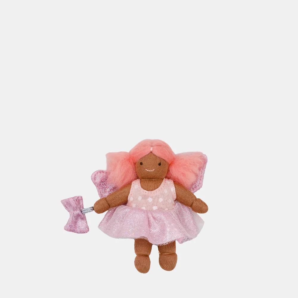 Plush toy fairy with pink hair and dress on a white background