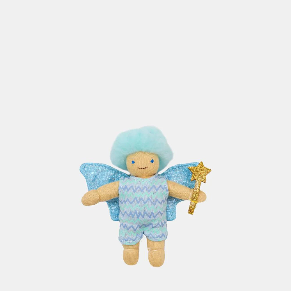 Stuffed toy fairy with blue hair, wings, and a star on a white background