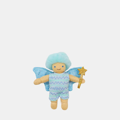 Stuffed toy fairy with blue hair, wings, and a star on a white background