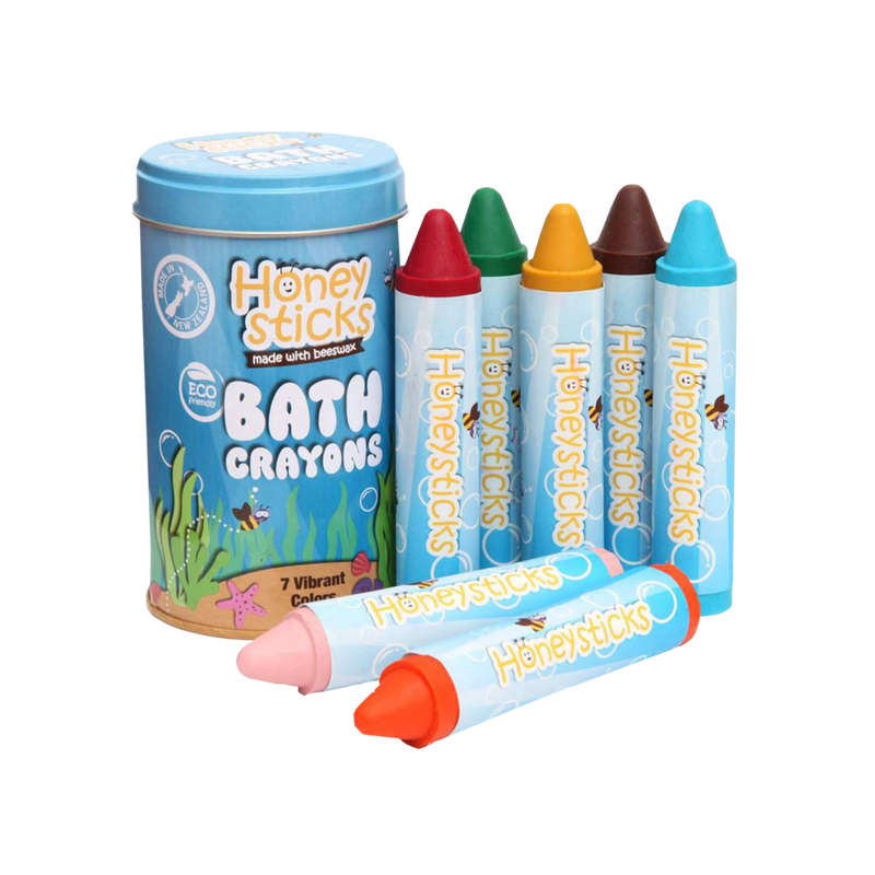 A set of Honeysticks brand bath crayons in various colors, displayed alongside a blue storage tin with the product name and description.