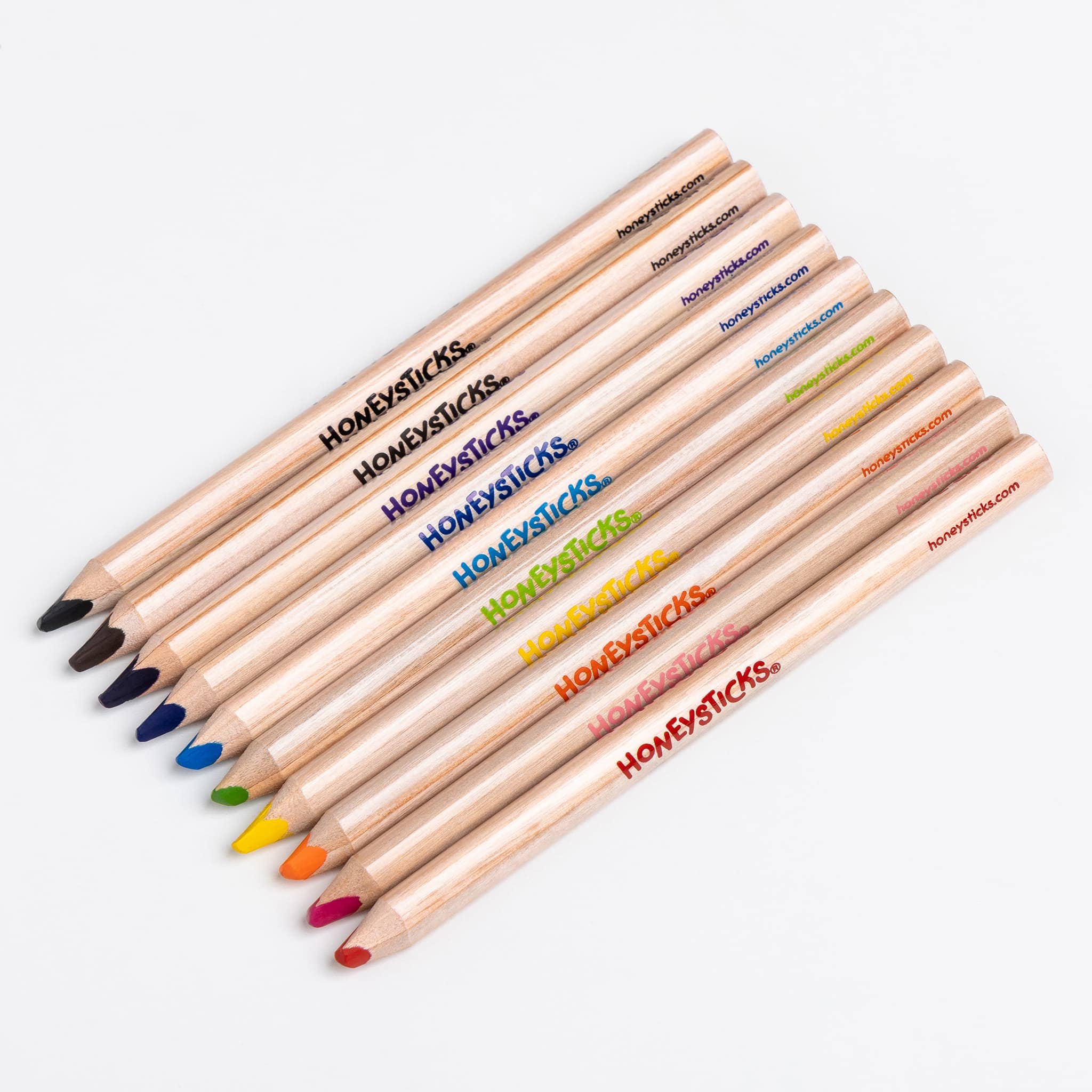 Set of colored pencils with 'Honeysticks' branding on a white background