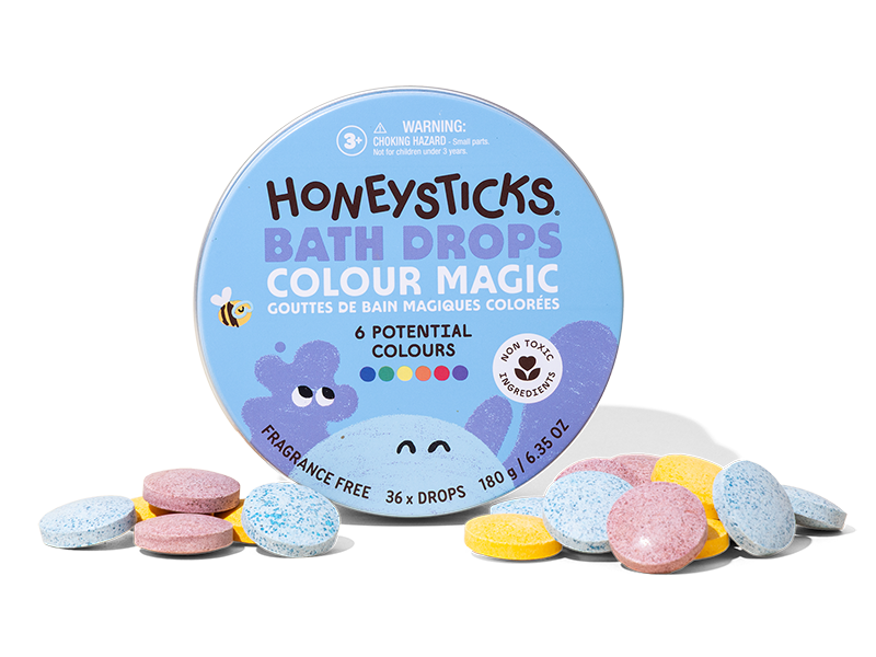 Honeysticks Bath Drops Colour Magic packaging with colorful bath bombs on a white background