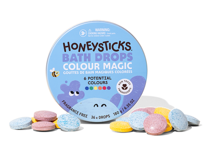Honeysticks Bath Drops Colour Magic packaging with colorful bath bombs on a white background