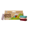 Honey Sticks Beeswax Crayons Blocks packaging with crayons on a green background