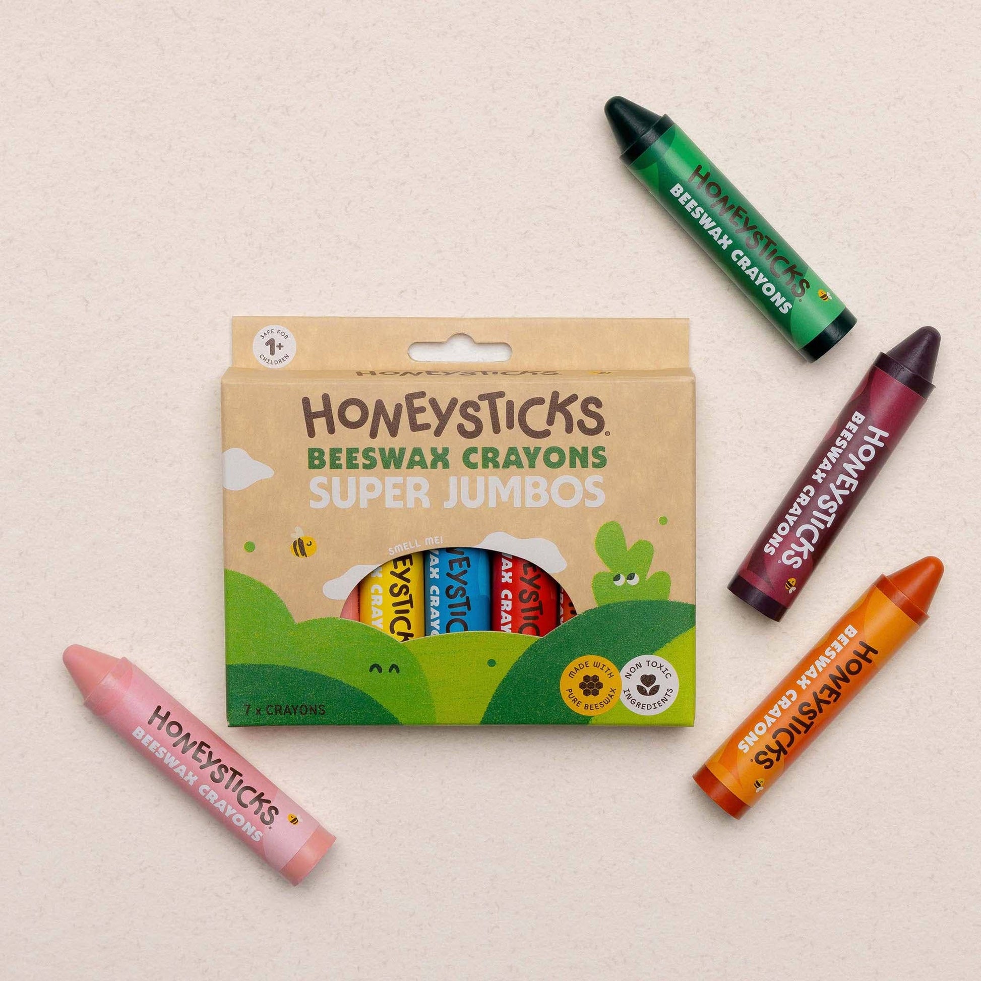 Honeysticks Beeswax Crayons packaging with four crayons on a beige background