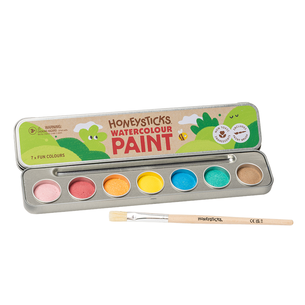 Honeysticks watercolour paint set with seven paint pots and a brush on a white background