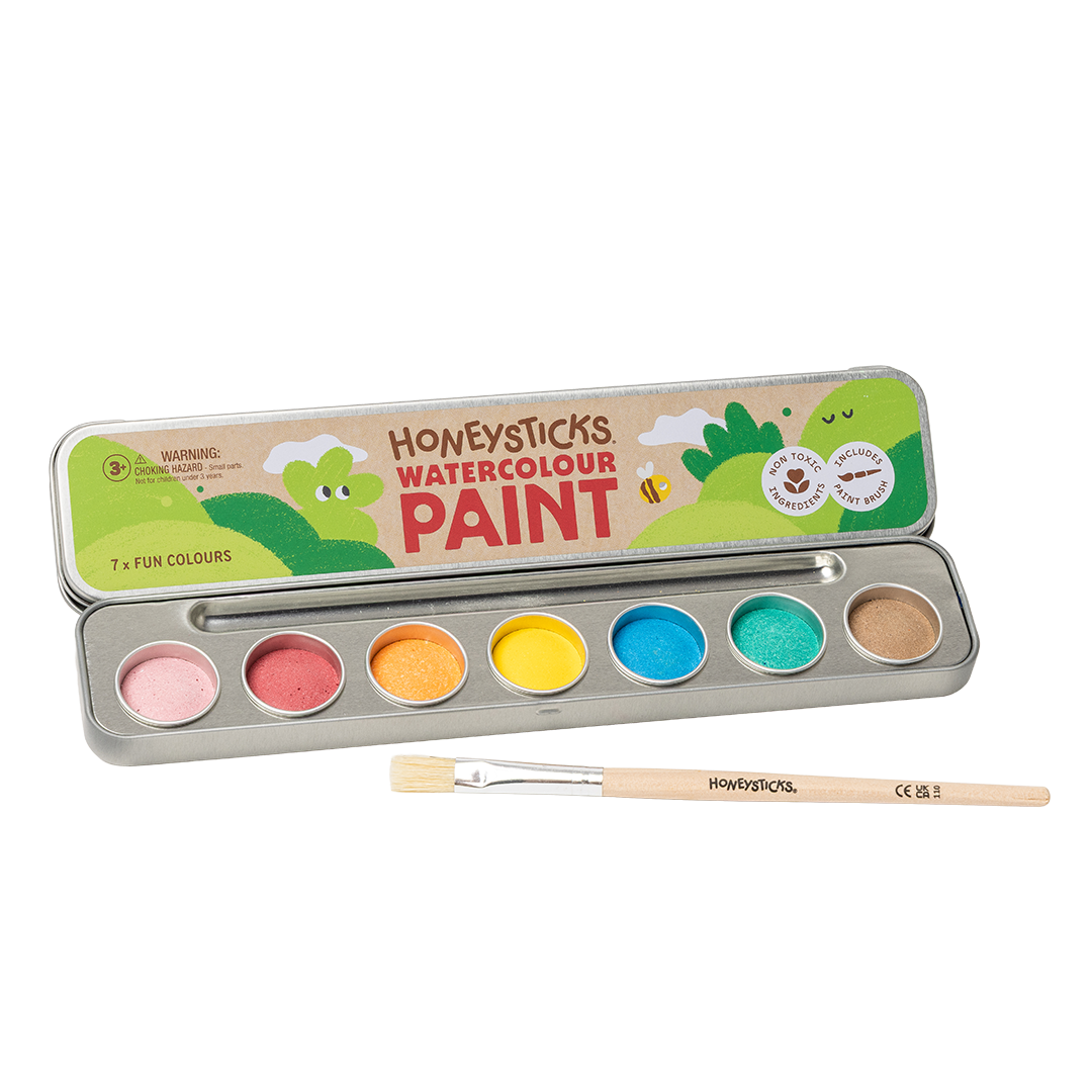Honeysticks watercolour paint set with seven paint pots and a brush on a white background